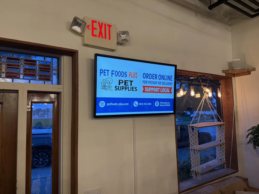 Wall screen at Pet Foods Plus in Bristol, Rhode Island running the store&rsquo;s own ad