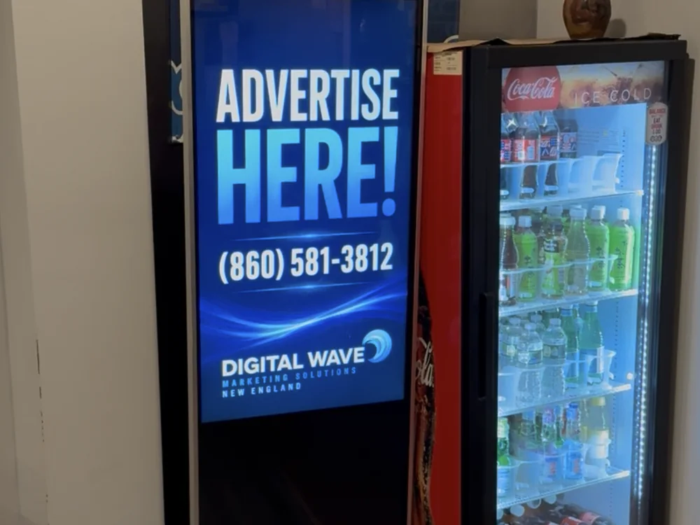 Freestanding floor totem in a Connecticut restaurant showing an Advertise Here card
