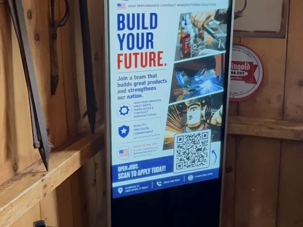 Freestanding floor totem in a Connecticut tavern running a Chapco recruiting ad
